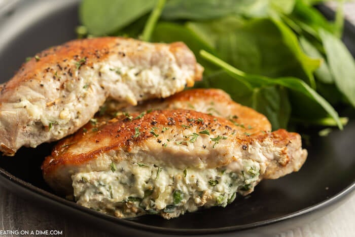 Baked Stuffed Pork Chops on a plate. 