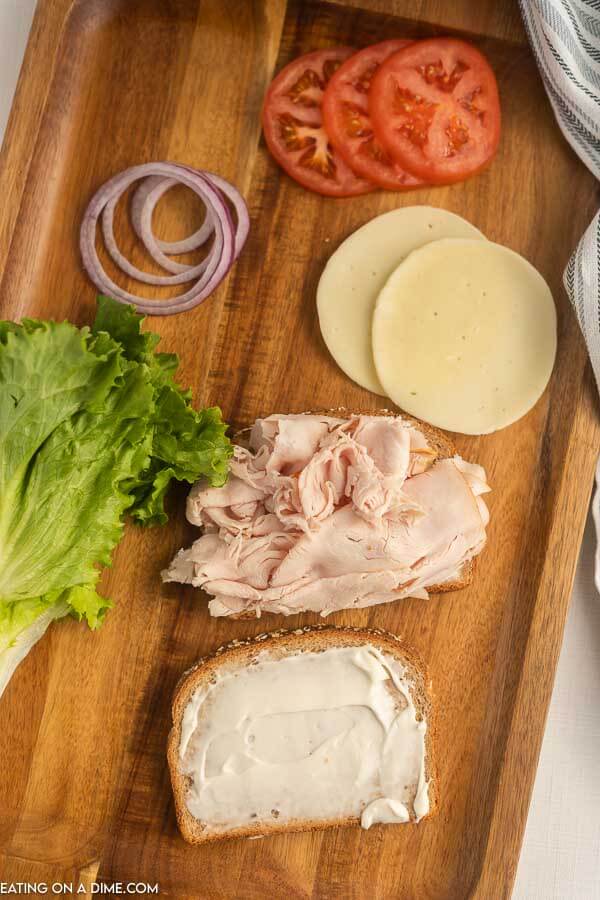 Process of making  turkey sandwich.