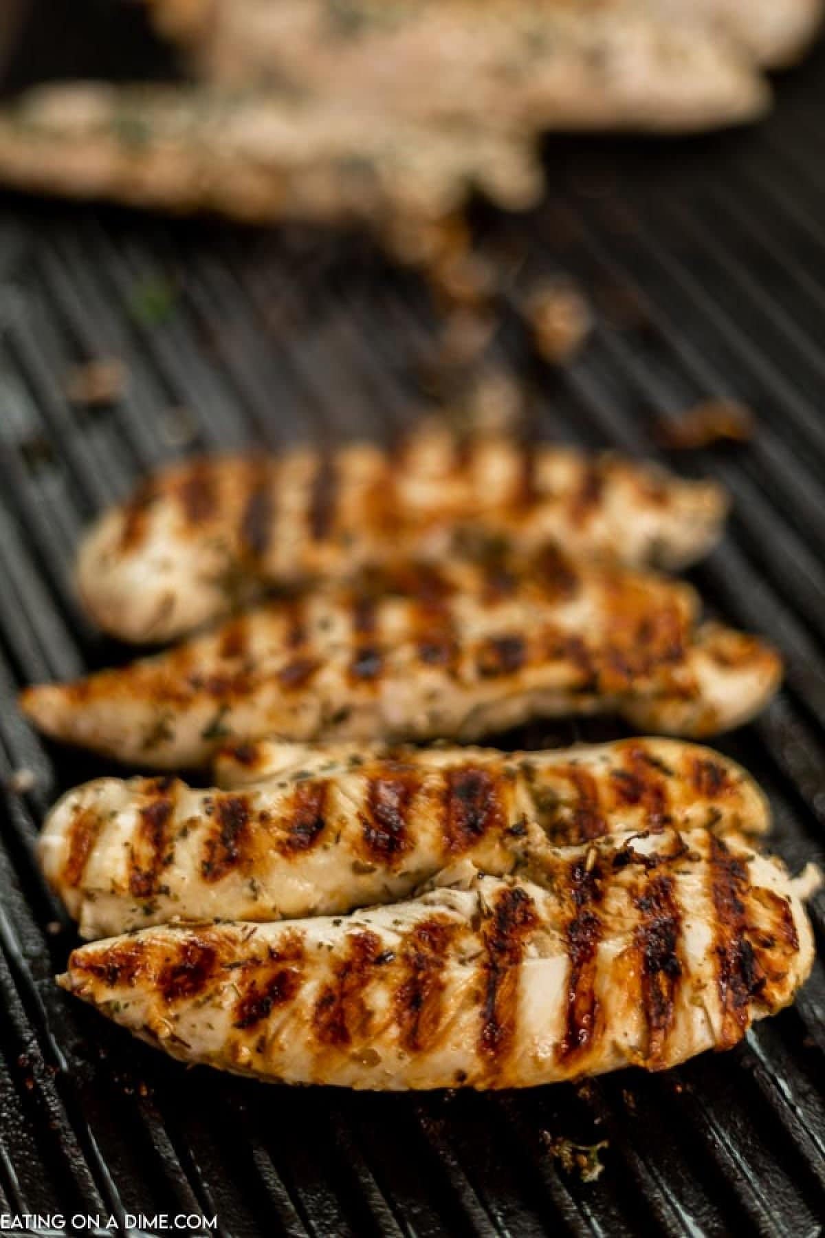 Grilled Chicken Tenders on the grill. 