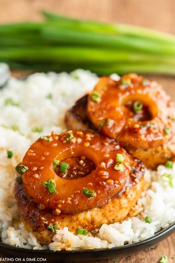 Hawaiian pork chops with rice on a plate. 