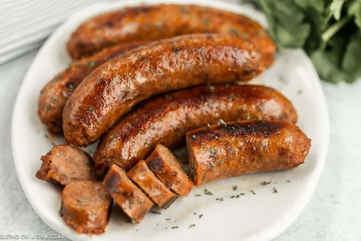 Close up image of italian sausage on a white plate.