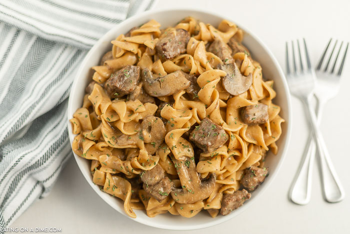 Close up image of beef stroganoff in a white bowl
