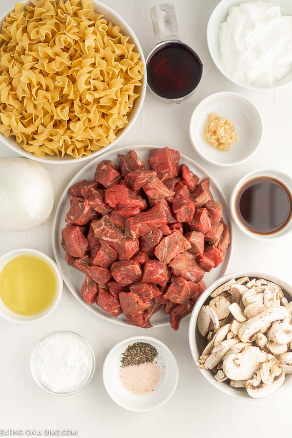 Ingredients needed - stew meat, olive oil, salt and pepper, minced garlic, red wine, onion, mushrooms, worcestershire sauce, beef broth, egg noodles, sour cream, cronstarch