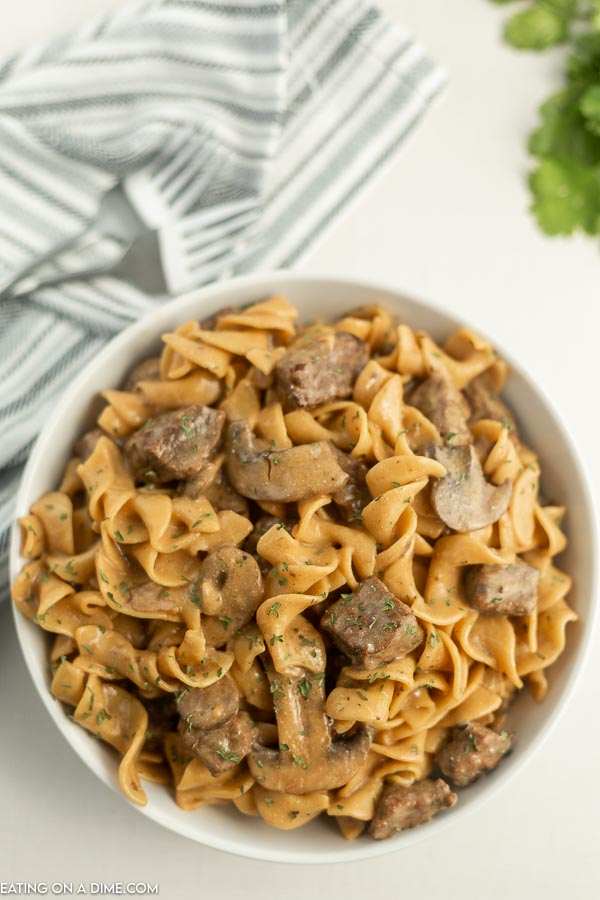 Close up image of beef stroganoff in a white bowl