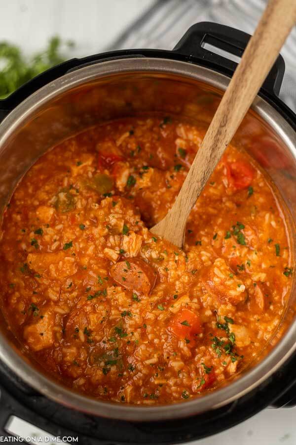 Close up image of Instant Pot Jambalaya with a wooden spoon