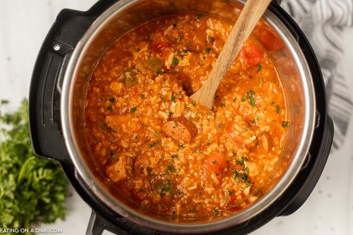Close up image of Instant Pot Jambalaya with a wooden spoon