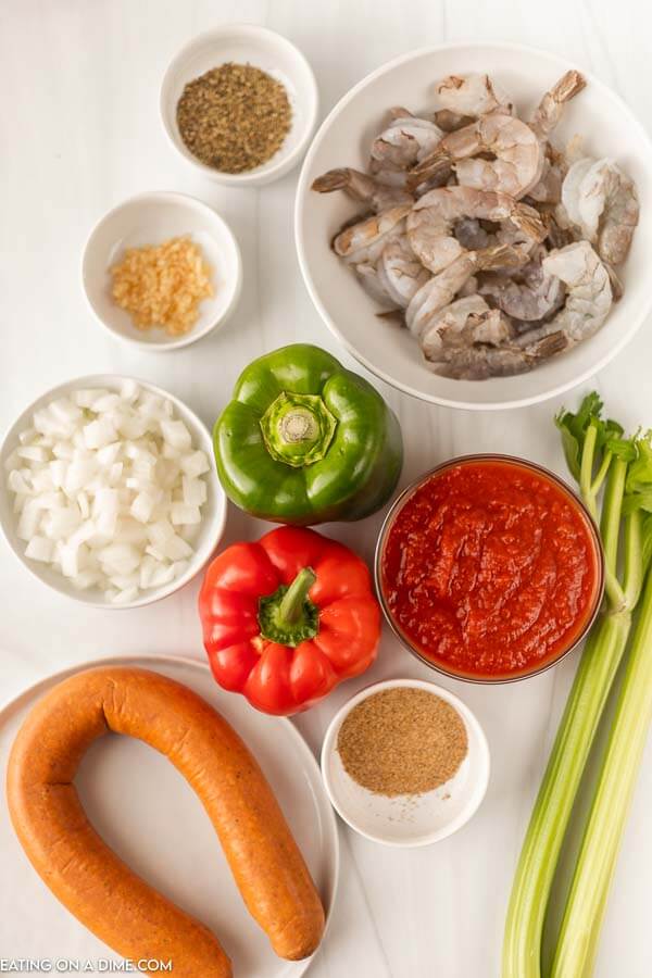 Ingredients needed - sausage, cajun seasoning, onion, celery, bell pepper, minced garlic, crushed tomatoes, dried oregano, chicken broth, shrimp, rice