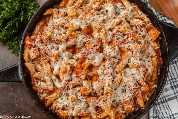 Close up image of Chicken Pepperoni Pasta in an iron skillet. 