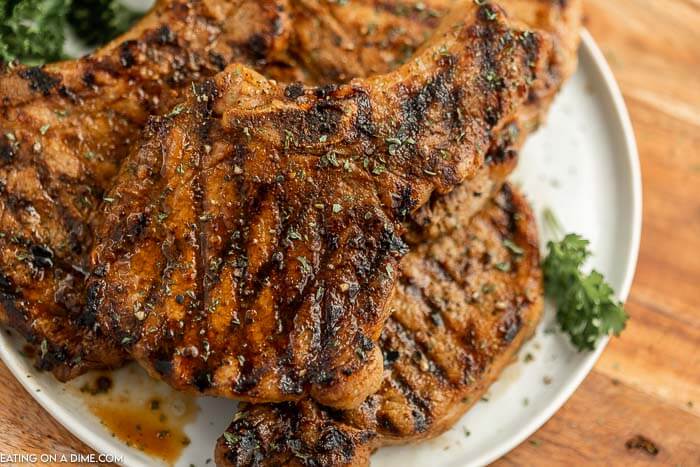 Grilled pork chops on a plate. 