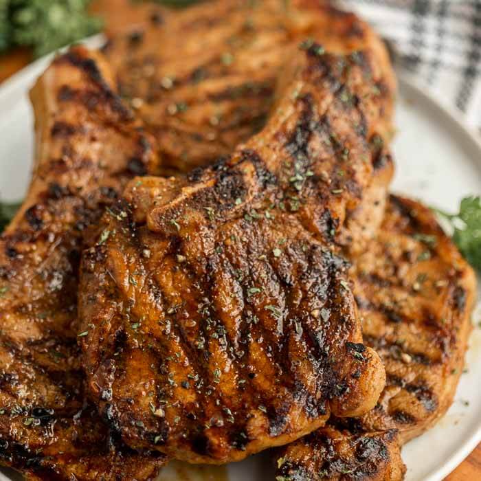 Grilled pork chops on plate. 