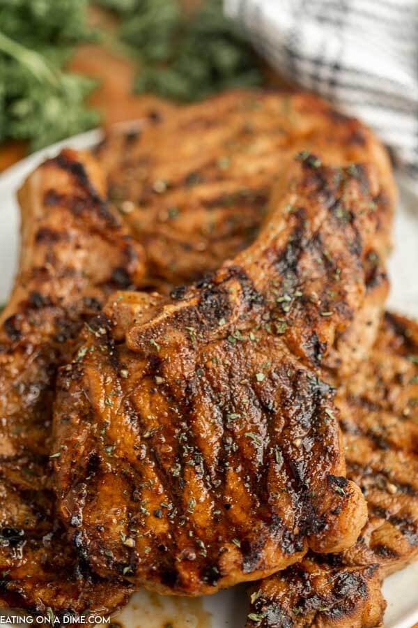 Grilled pork chops on a plate. 