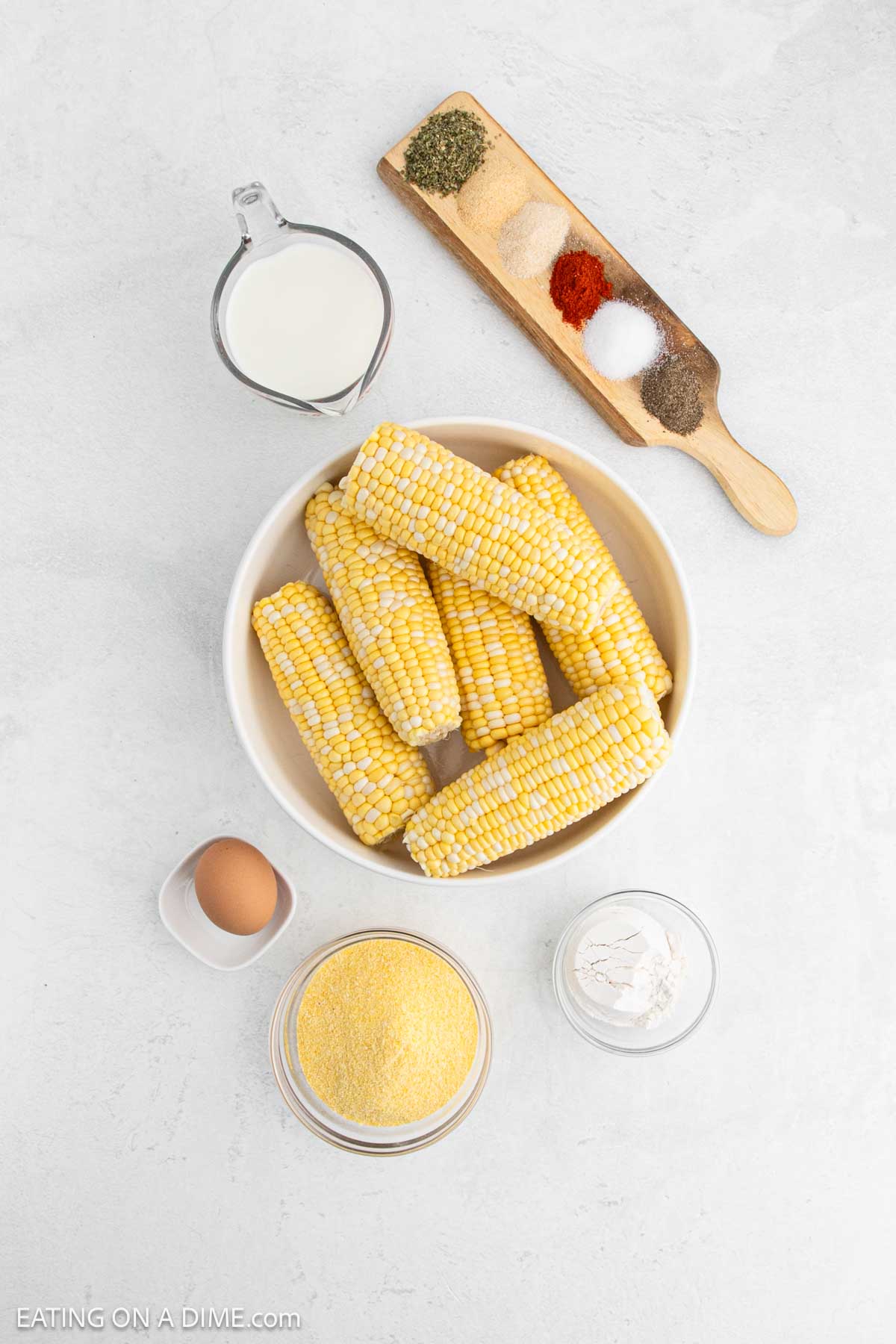 Ingredients, - corn on the cob, milk, egg, cornmeal, flour, Italian seasoning, onion powder, garlic powder, salt, pepper, paprika, vegetable oil