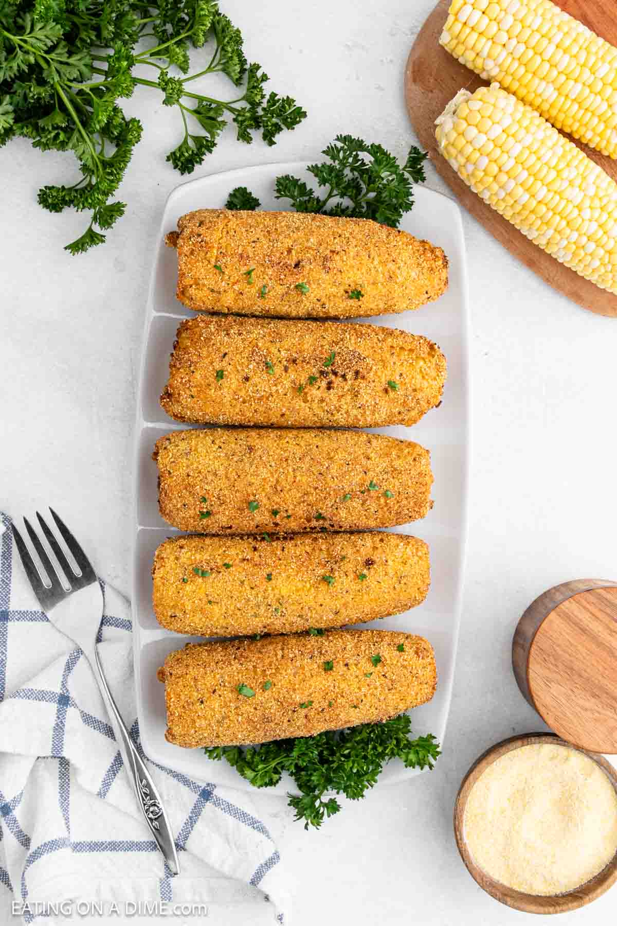 Deep Fried corn on the cob on a platter