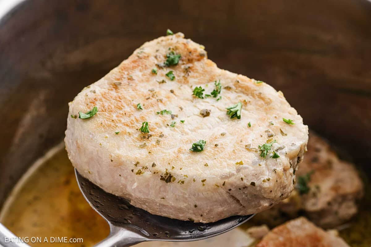 Instant Pot Pork Chops served on a spoon.