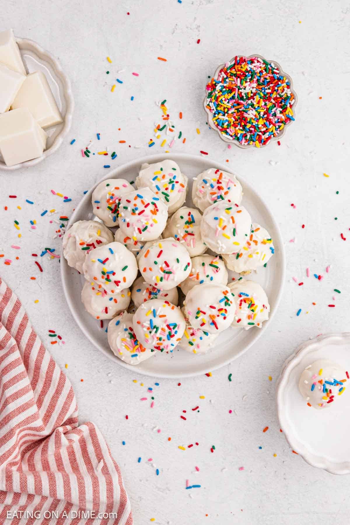 Prepared cake balls topped with sprinkles.