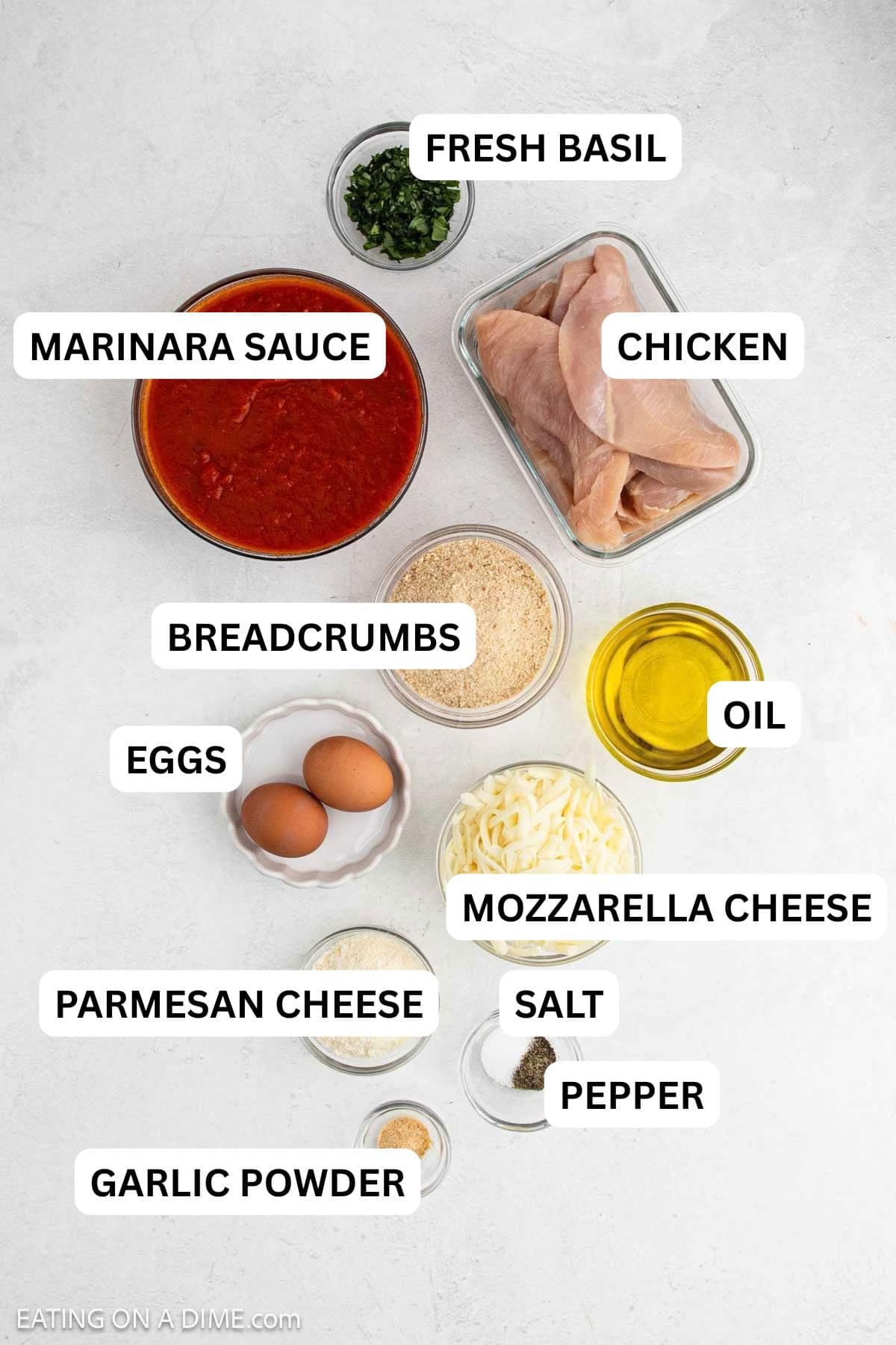 Ingredients needed for this recipe includes chicken breasts, eggs, breadcrumbs, salt, pepper, parmesan cheese, garlic powder, oil, marinara sauce, and mozzarella cheese.