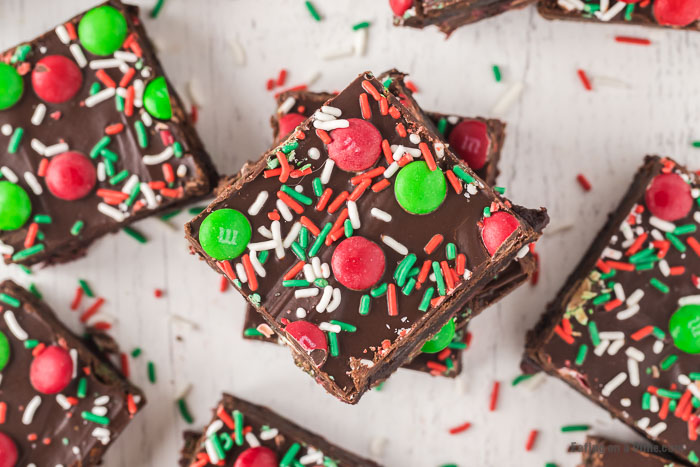 Christmas brownies decorated with red and green sprinkles and Christmas M&M stacked