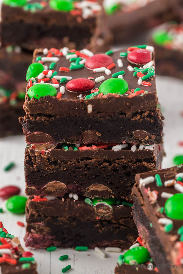 Christmas brownies decorated with red and green sprinkles and Christmas M&M stacked