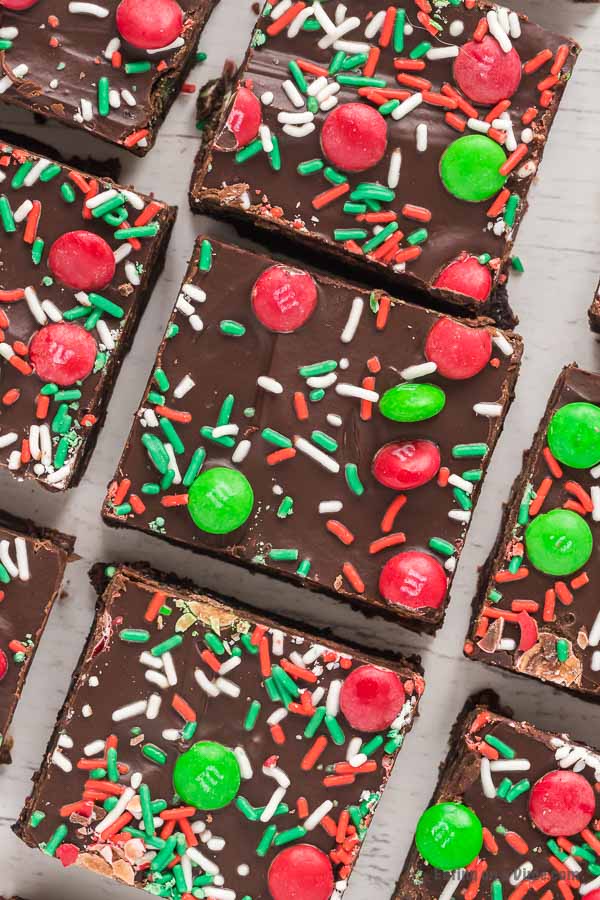 Christmas brownies decorated with red and green sprinkles and Christmas M&M cut into squares