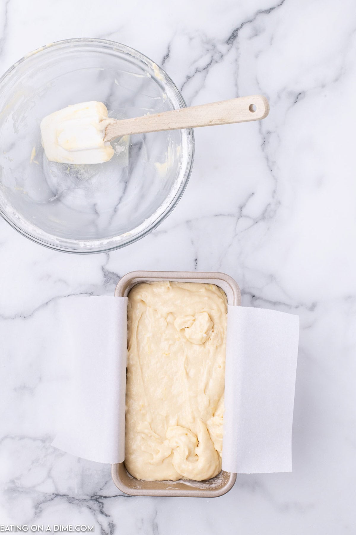 Pour the lemon bread batter into loaf pan lined with parchment paper