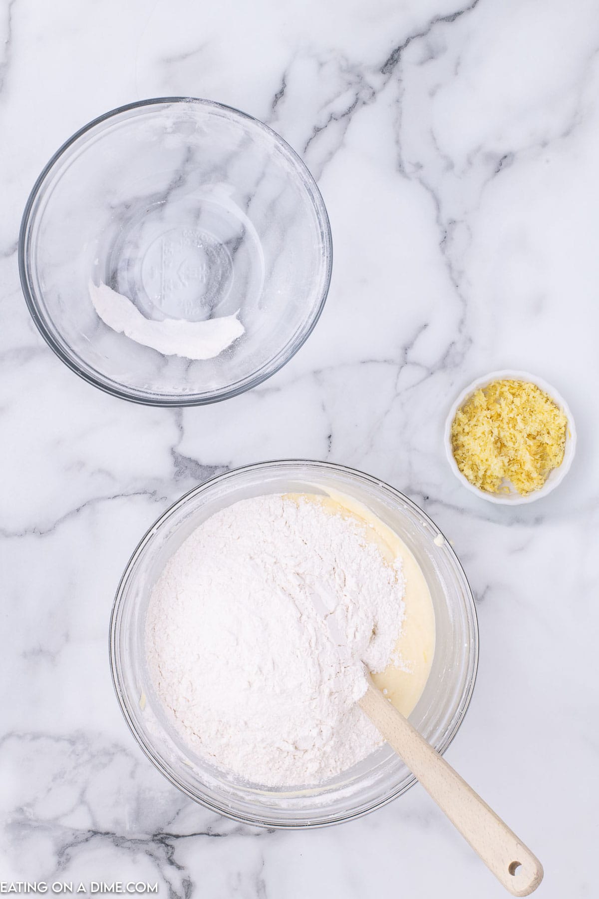 Mix dry ingredients into wet ingredients in a bowl with a spatula