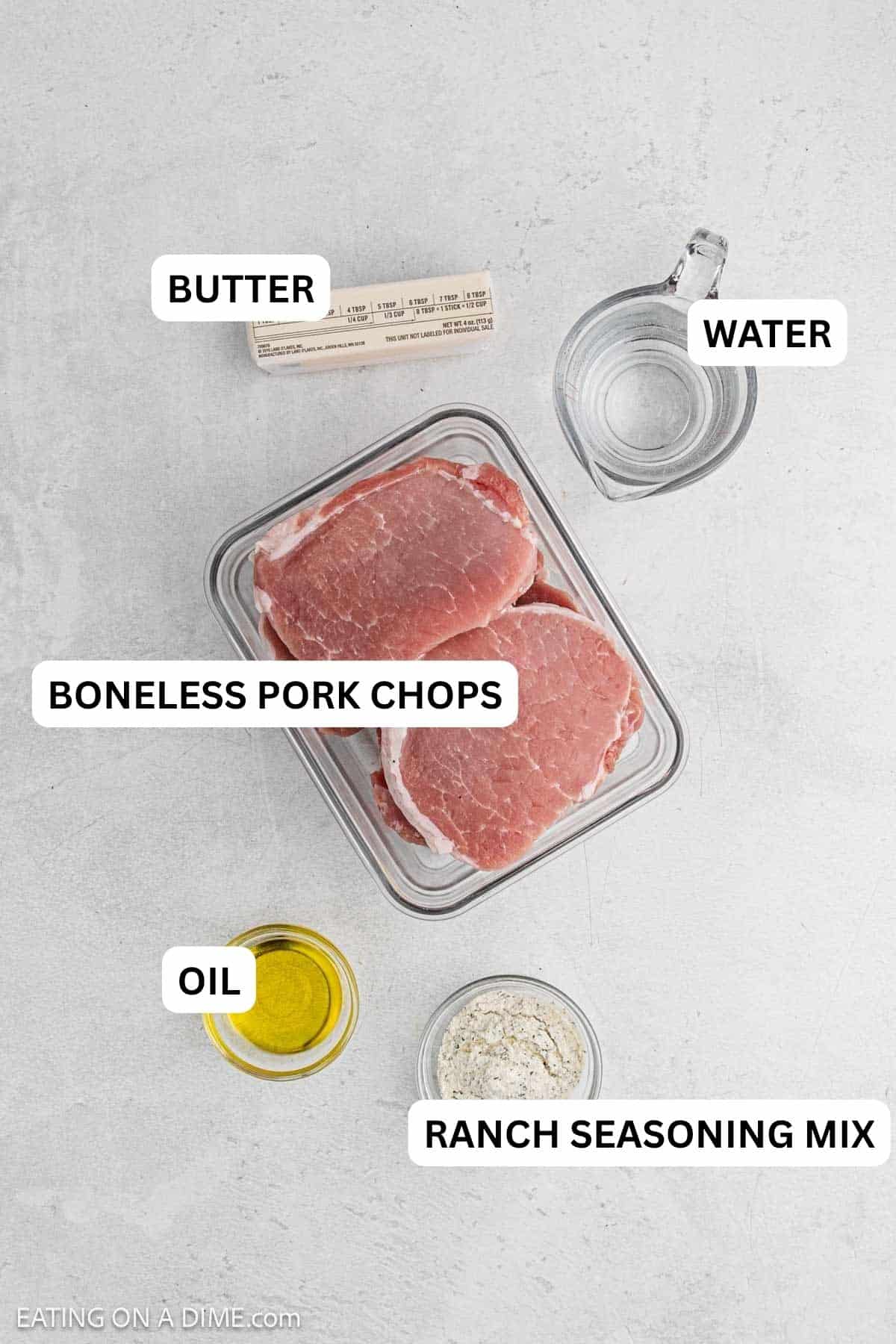 Ingredients needed for this recipe which includes oil, pork chops, butter, ranch seasoning mix, and water.