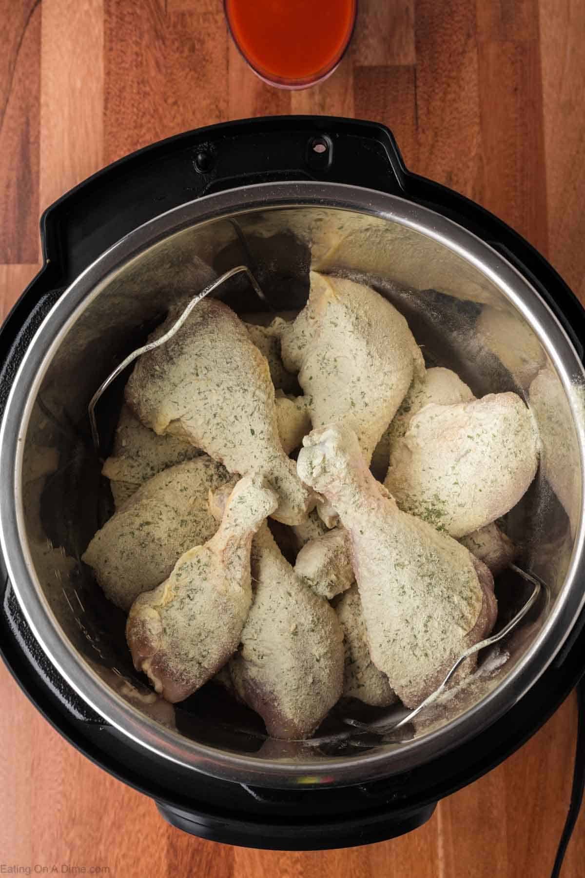 Ranch mix seasoning sprinkled over the chicken legs in the instant pot