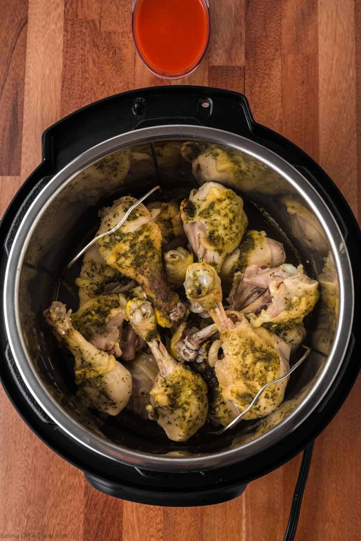 Cooked seasoned chicken legs in the instant pot