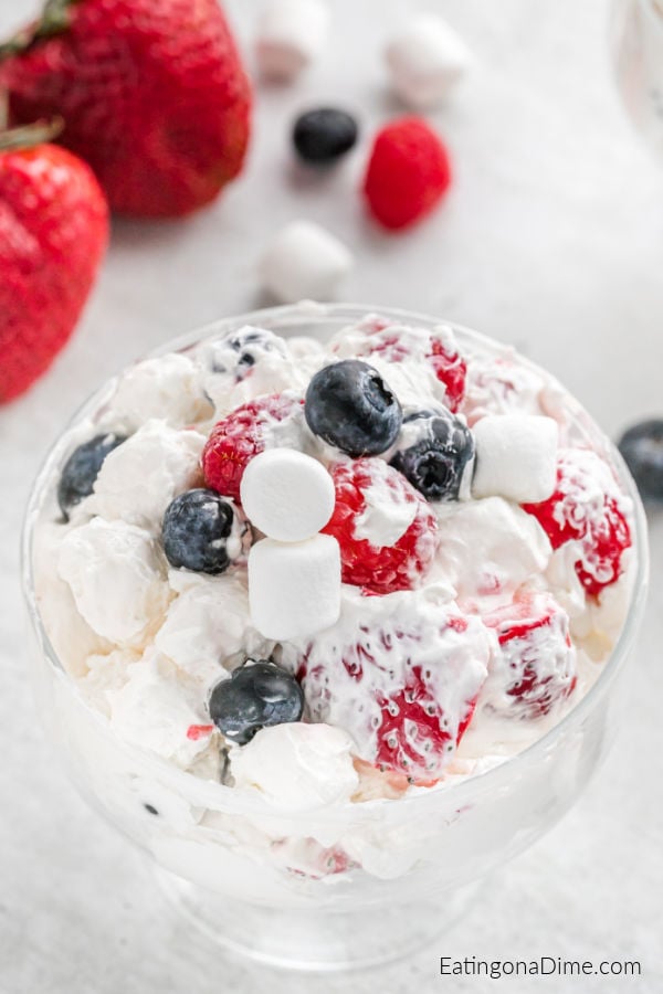 A bowl of Red White and Blue Cheesecake Salad. 