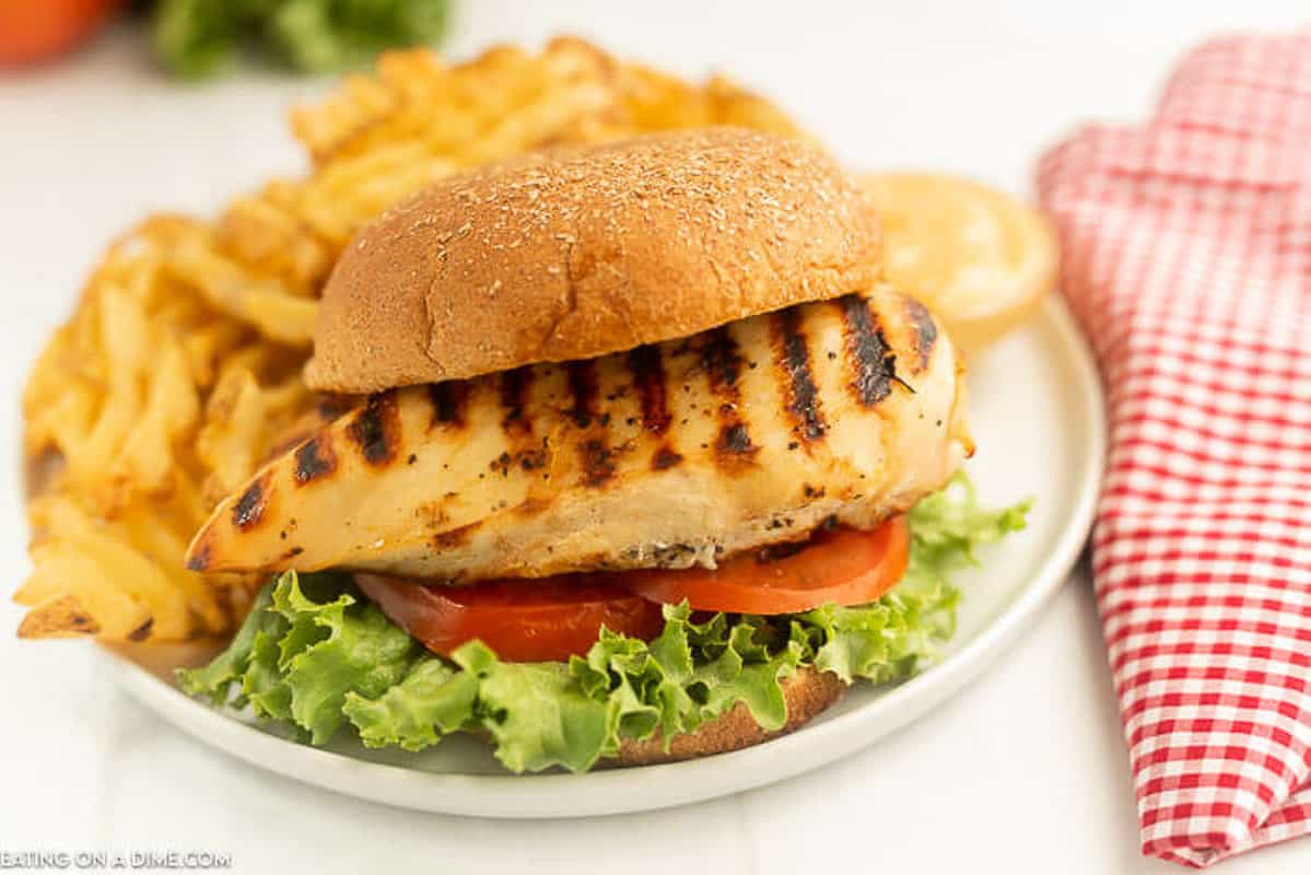Chick-fil-a Grilled Chicken Sandwich on a plate with fries.