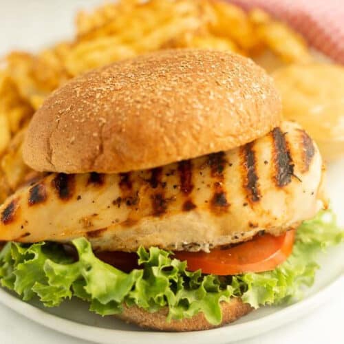 Chick-fil-a Grilled Chicken Sandwich on a plate with fries.