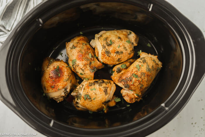 Close up image of Cilantro Lime Chicken Thighs in the slow cooker. 