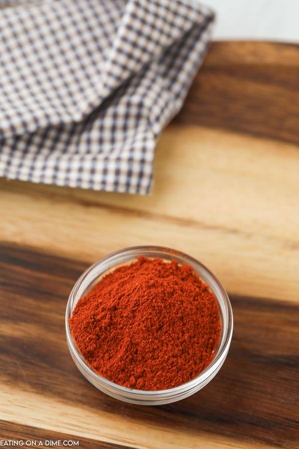 close up image of paprika powder in a jar 
