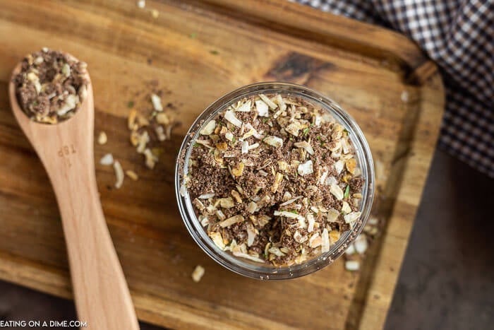 Onion soup mix in a bowl with a whisk on a cutting board