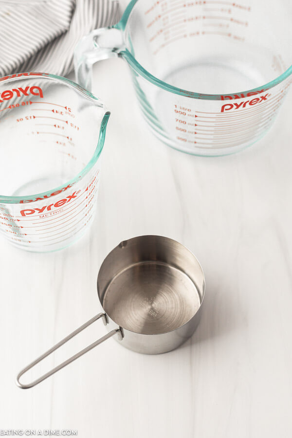 Close up image of a measuring cup and two liquid measuring cups. 