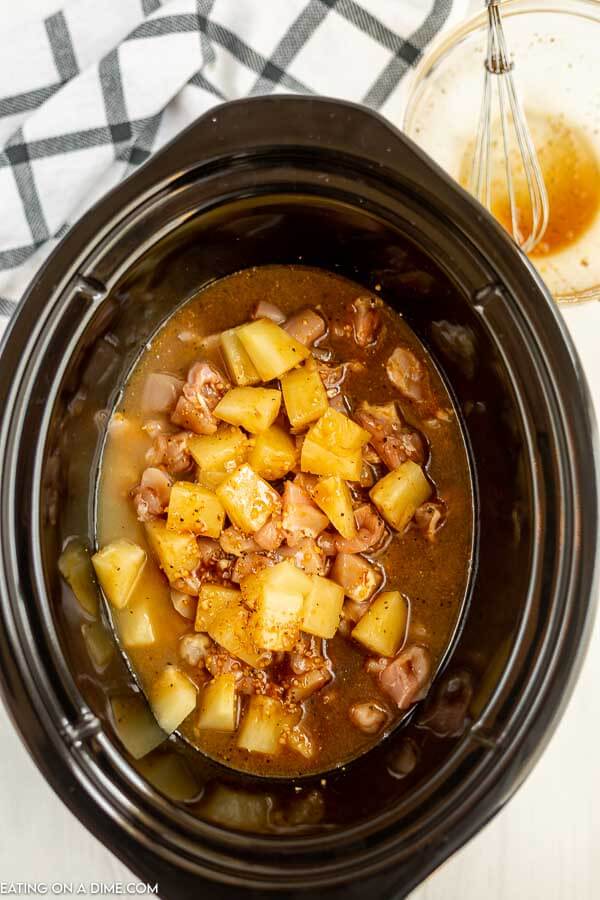 Hawaiian Chicken ingredients placed in the crock pot ready to cook. 