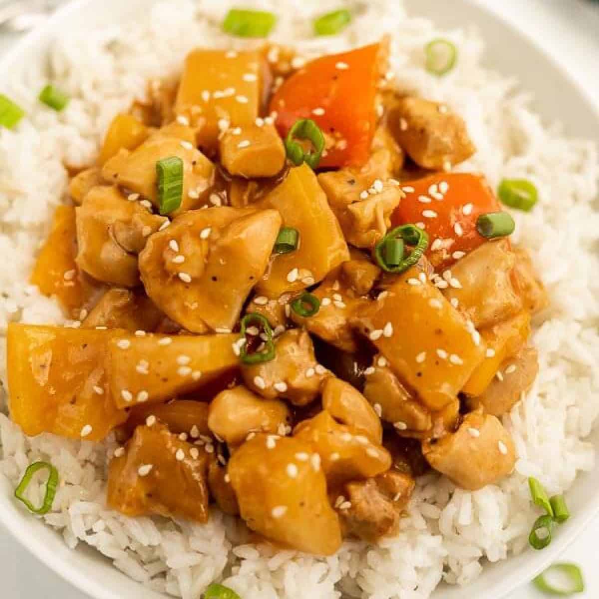 Crock Pot Hawaiian Chicken on a rice on a plate.