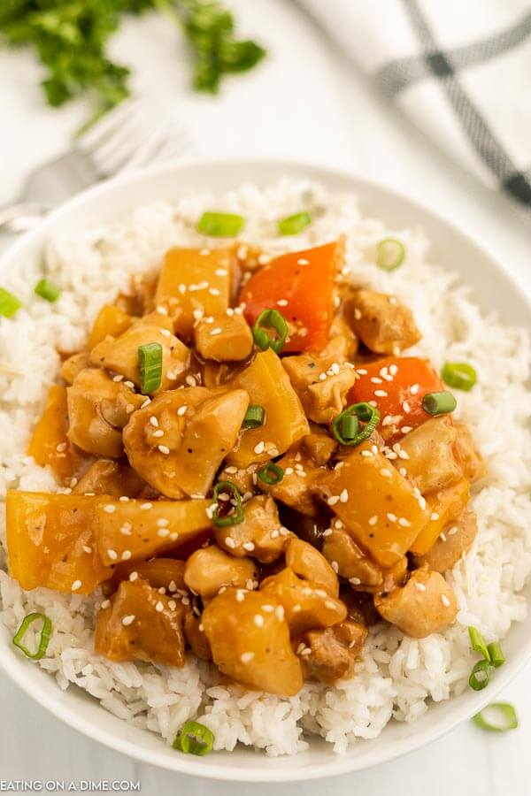 Crock Pot Hawaiian Chicken on a rice on a plate. 