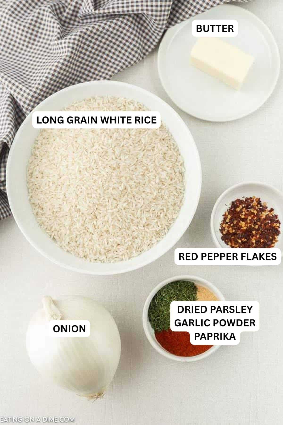 Ingredients for recipe: butter, white rice, red pepper flakes, dried parsley, garlic powder, paprika and onion.