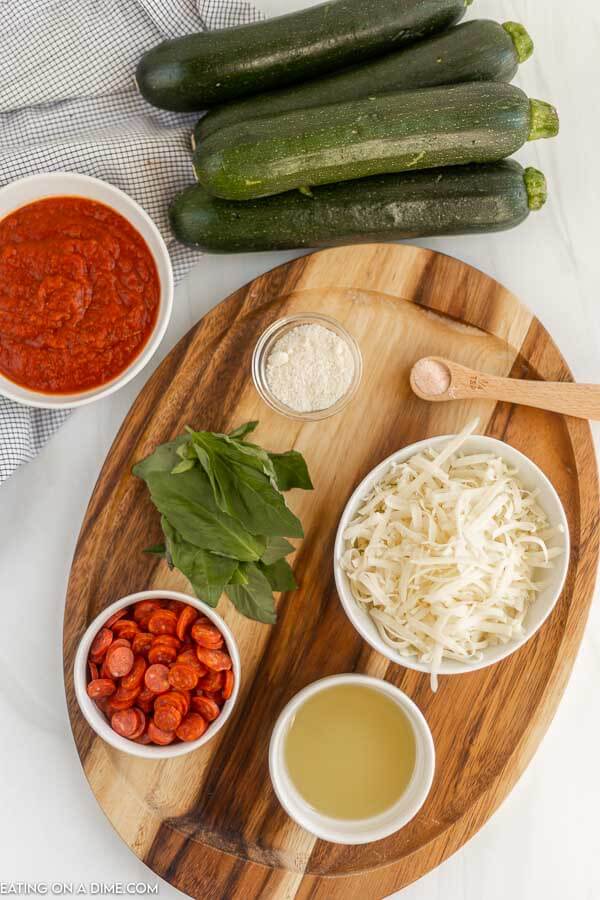 Ingredients needed - zucchini, olive oil. salt, pizza sauce, mozzarella cheese, pepperoni, parmesan cheese