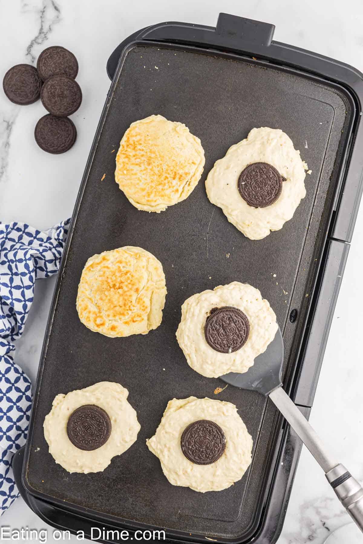 Cooking the Oreo Pancakes on a griddle