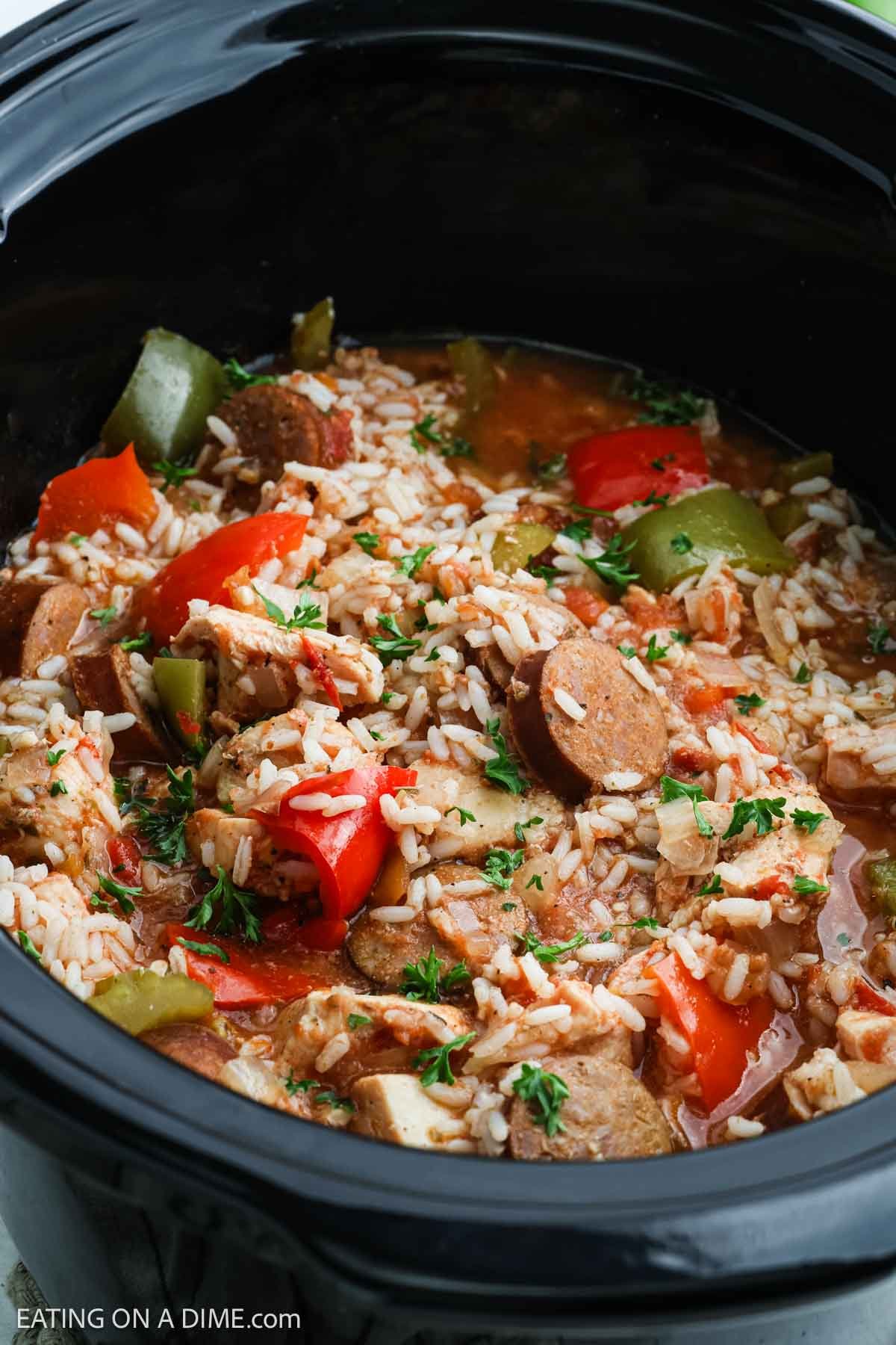 Chicken and Sausage Jambalaya in the slow cooker with cooked rice and green and red bell pepper