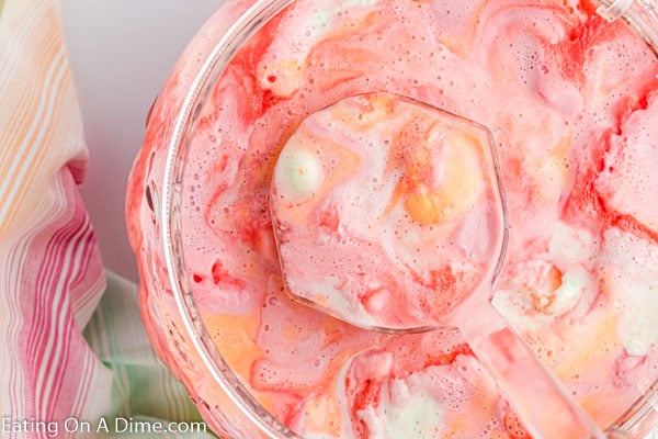 Rainbow sherbet punch in a punch bowl. 