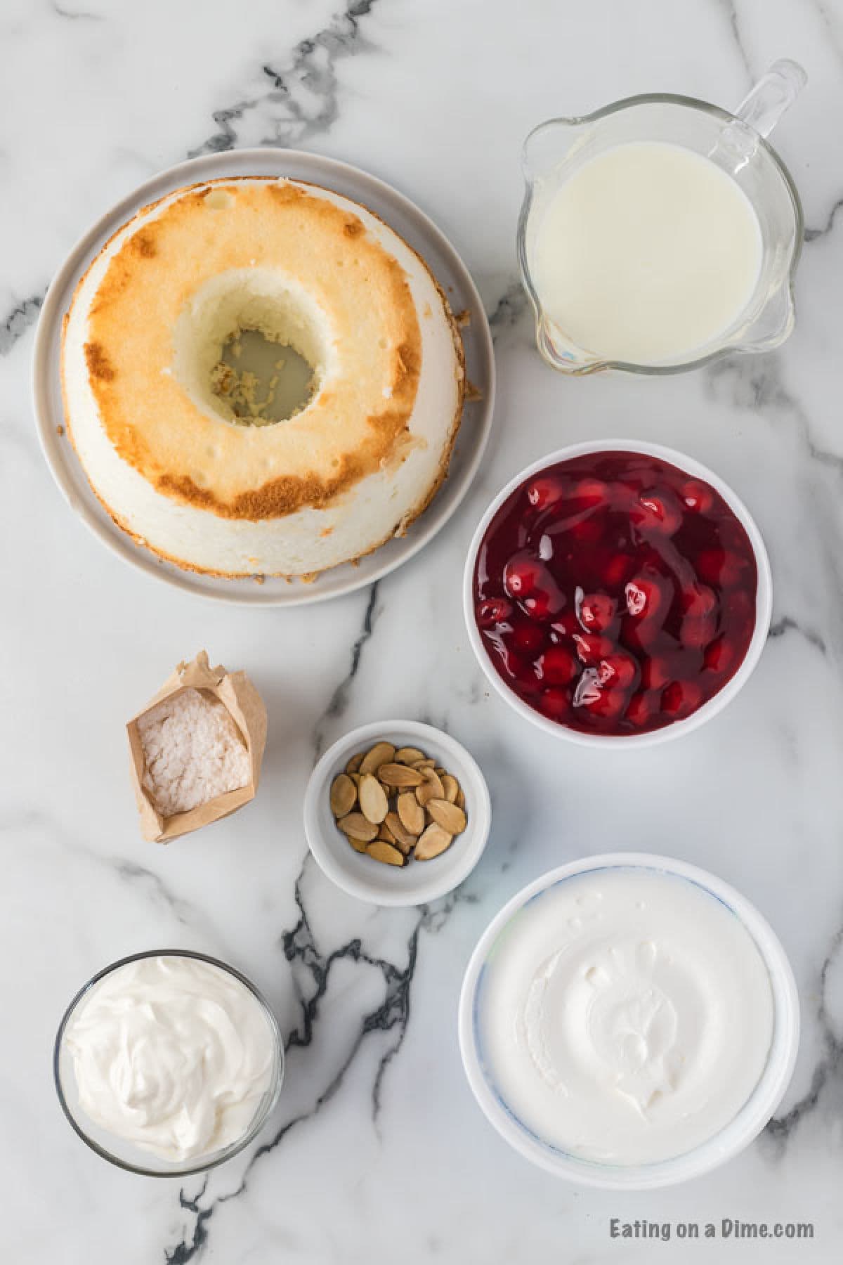 Ingredients needed - angel food cake, cherry pie filling, vanilla pudding mix, milk, sour cream, whipped topping, almond slices