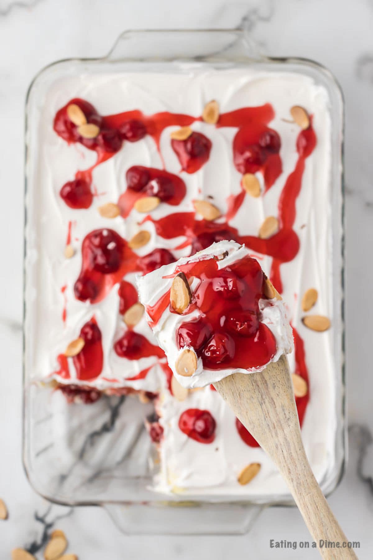 Close up image of heaven on earth cake with a serving on a wooden spoon. 