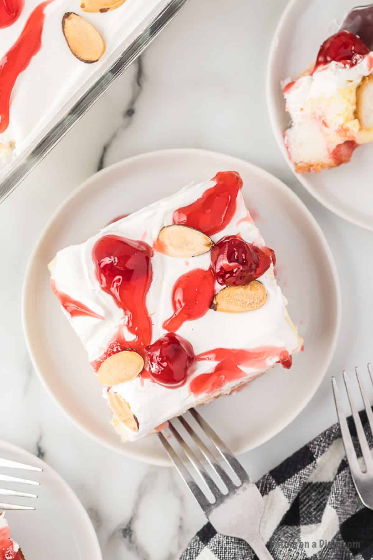 Close up image of a serving on heaven on earth cake on white plate. 