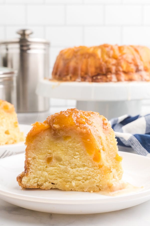 Slice of Peach Cobber Pound Cake on a white plate