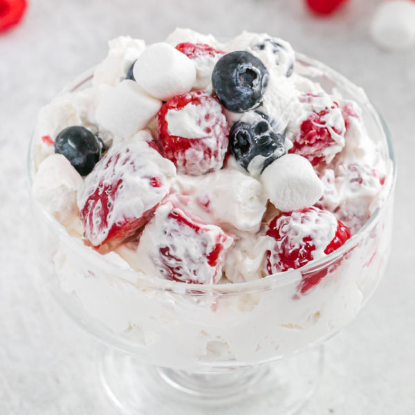 A bowl of Red White and Blue Cheesecake Salad. 