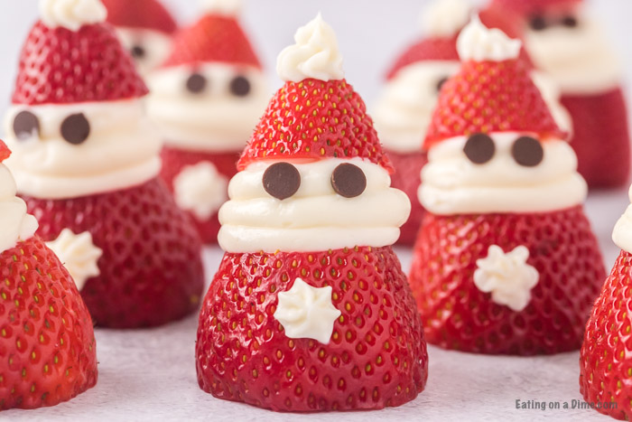 Close up image of Strawberry Santas in a row
