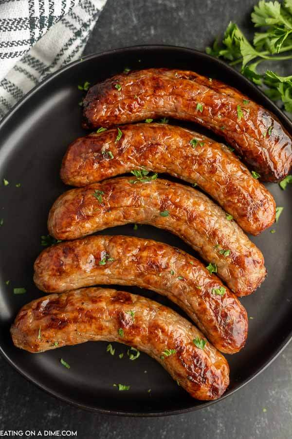 Air fryer brats on a plate. 